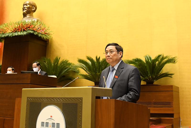 Thủ tướng Chính phủ Phạm Minh Chính báo cáo trước Quốc hội - Ảnh: Quochoi.vn