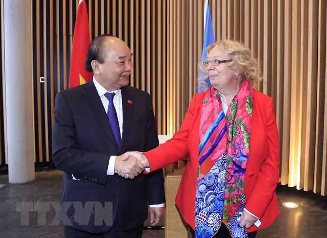 Chủ tịch nước Nguyễn Xuân Phúc và Tổng Giám đốc Văn phòng Liên hợp quốc tại Geneva Tatiana Valoya - Ảnh: TTXVN