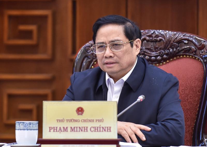 Thủ tướng Phạm Minh Chính  tại cuộc họp sáng 5/12 - Ảnh: VGP