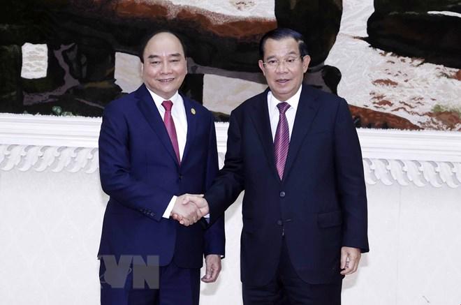 Chủ tịch nước Nguyễn Xuân Phúc và Thủ tướng Campuchia Samdech Techo Hun Sen - Ảnh: TTXVN