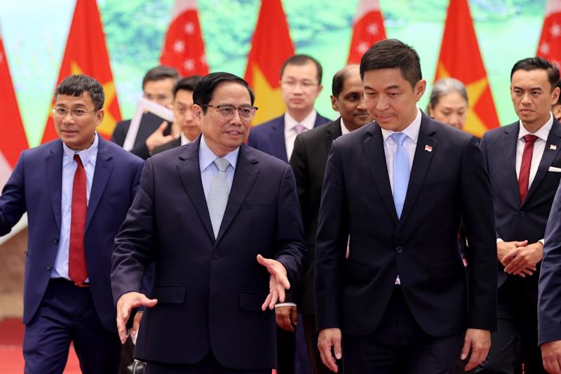 Thủ tướng Phạm Minh Chính và Chủ tịch Quốc hội Singapore Tan Chuan-Jin - Ảnh: VGP
