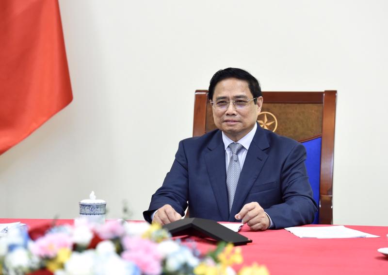 Thủ tướng Phạm Minh Chính đề nghị hai bên tích cực nghiên cứu các biện pháp duy trì giao thương thông suốt, nâng cao năng lực, hiệu suất thông quan - Ảnh: VGP