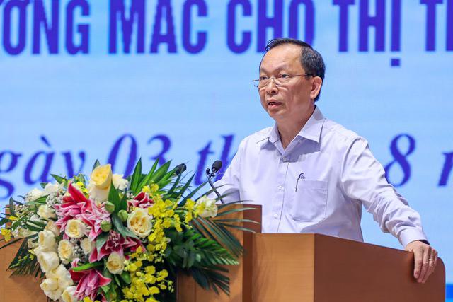 Phó Thống đốc Ngân hàng Nhà nước Việt Nam Đào Minh Tú báo cáo tại Hội nghị - Ảnh: VGP/Nhật Bắc.
