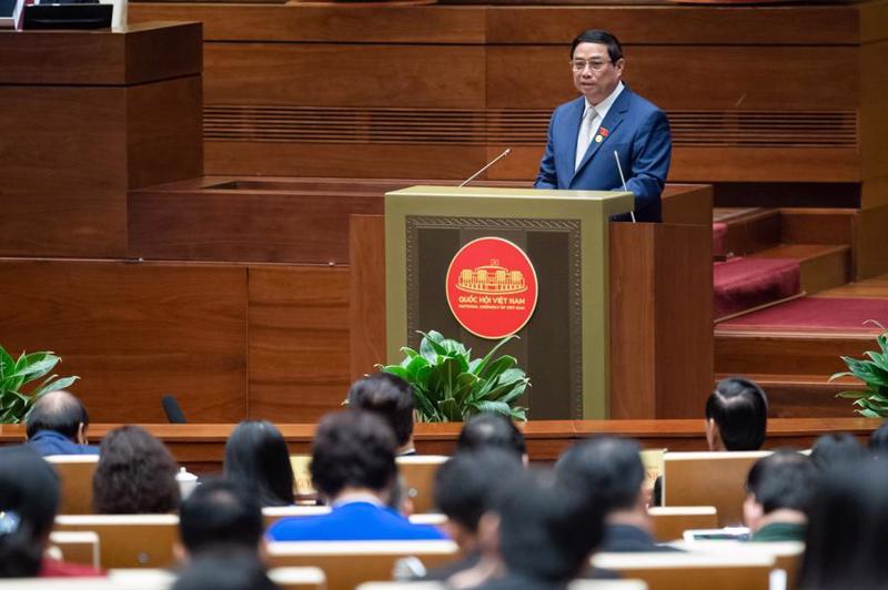 Prime Minister Pham Minh Chinh presents the government report on socio-economic results to the 6th session of the 15th National Assembly in Hanoi on October 23. Photo: quochoi.vn