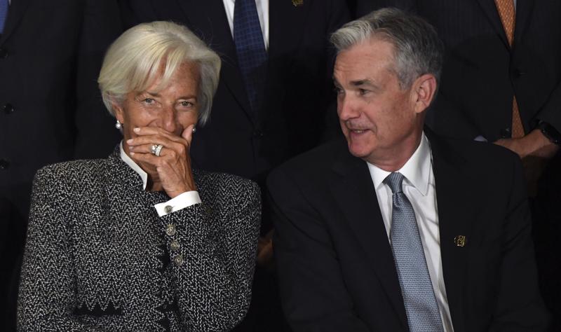 Chủ tịch ECB Christine Lagarde (trái) và Chủ tịch Fed Jerome Powell - Ảnh: BLoomberg.