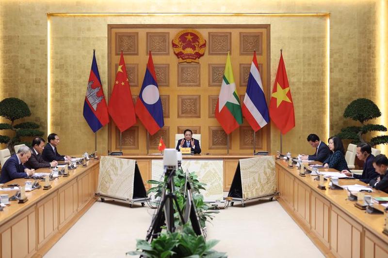 Prime Minister Pham Minh Chinh delivering an address to the meeting via videoconference on December 25. 