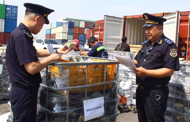 Customs officers checking imported goods. 