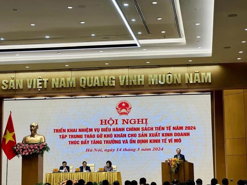 First Deputy Governor of the SBV Dao Minh Tu addressing the conference on March 14. (Source: VNA)