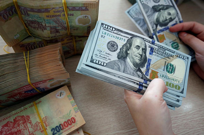Vietnam's central bank has begun selling USD to stabilize the currency market. (Photo source: Vietnam Insider)