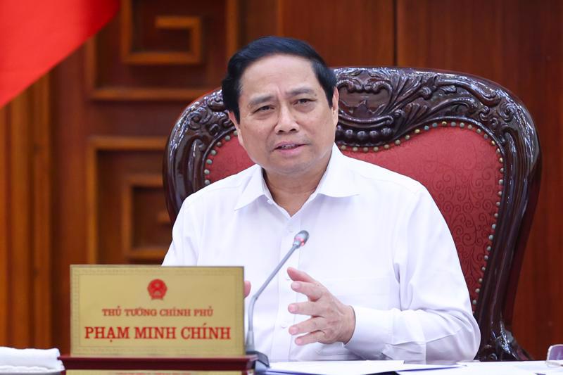 Prime Minister Pham Minh Chinh chairing the meeting on the development of social houses held in Hanoi on May 17.(Photo: VGP)