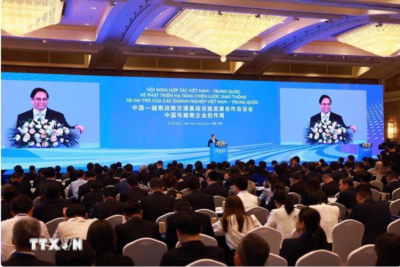 PM Pham Minh Chinh is addressing the conference in Beijing on June 27 (Photo: VNA)