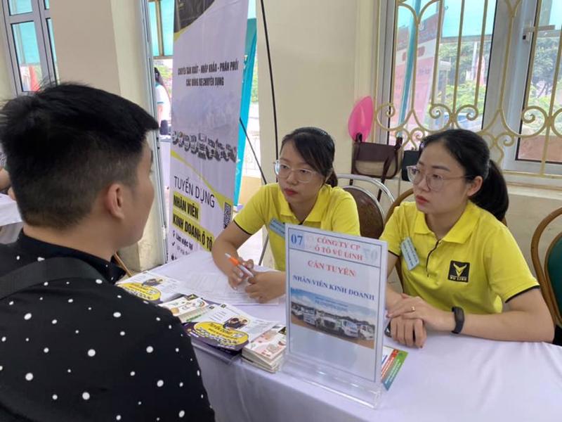 A laborer is interviewed at a job transaction fair. 