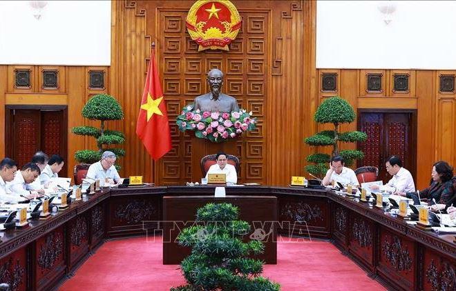 PM Pham Minh Chinh chairs a meeting between the permanent cabinet members and the steering committee for developing the project on regional and international financial centres on September 30. (Photo: VNA)