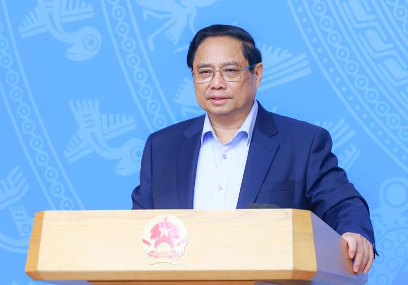 Prime Minister Pham Minh Chinh addressing the meeting in Hanoi on October 2. 