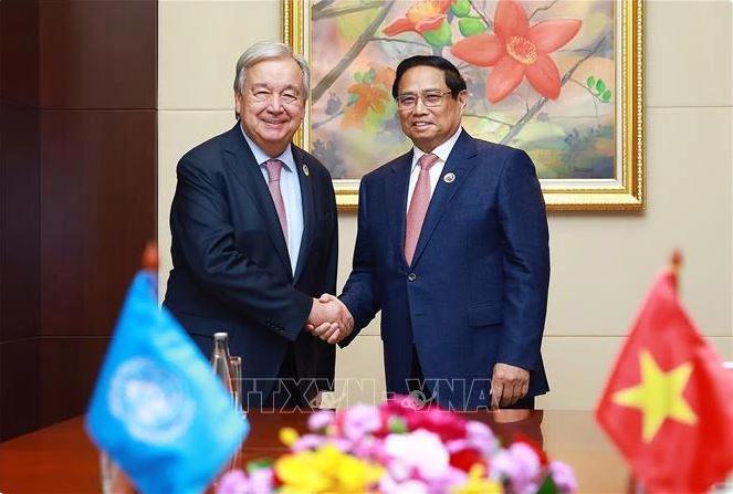 Prime Minister Pham Minh Chinh (R) and UN Secretary-General Antonio Guterres during their meetings in Vientiane on October 11. (Photo: VNA)