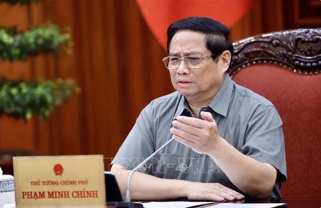 Prime Minister Pham Minh Chinh speaks at the meeting on October 19. (Photo: VNA)