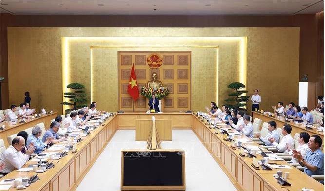 At the Prime Minister's working session with the Government's policy advisory council, held in Hanoi on May 8. (Photo: VNA)