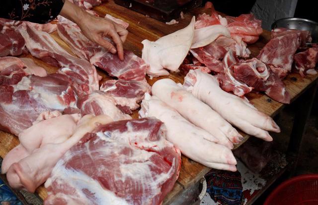 Giá thịt heo tăng cao kỷ lục, người tiêu dùng lao đao - Ảnh 1.