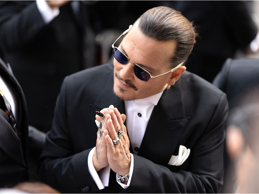 Johnny Depp Receives Applause as He Walks Red Carpet at Cannes